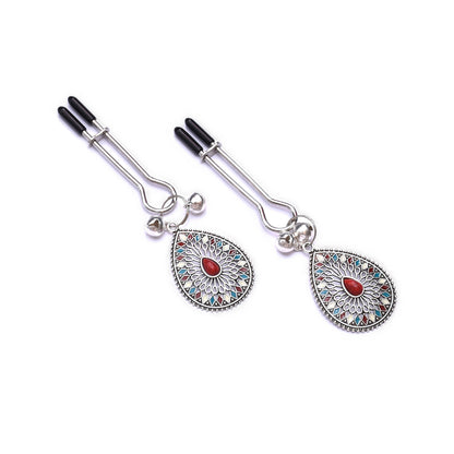 Nipple clamps with bell and red stone pendant
