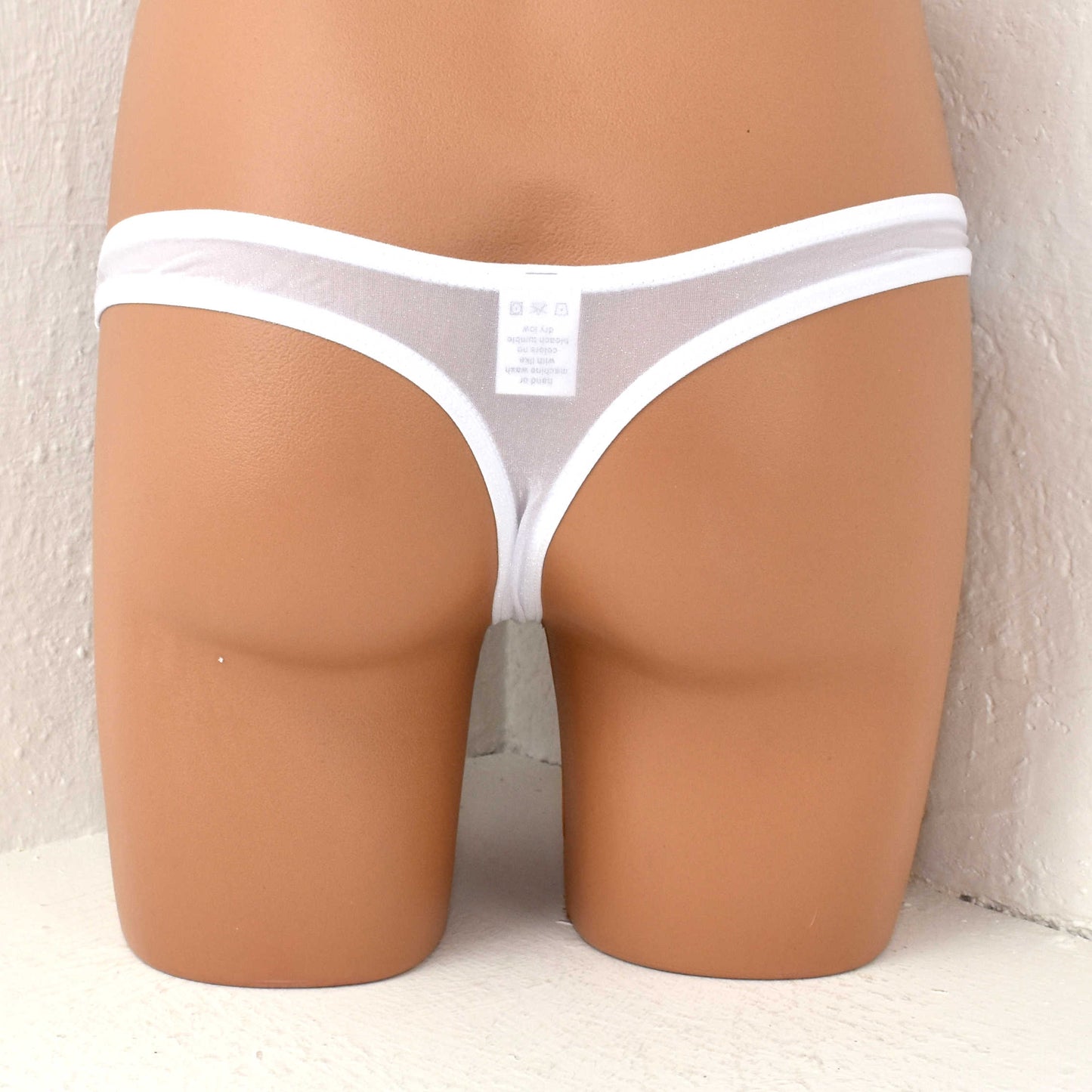 String thong with glittering fibers