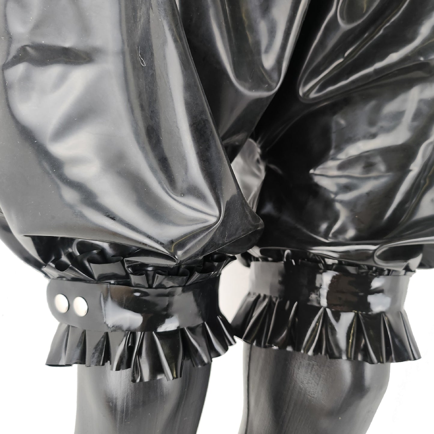 Latex shorts with ruffles at the waist and leg