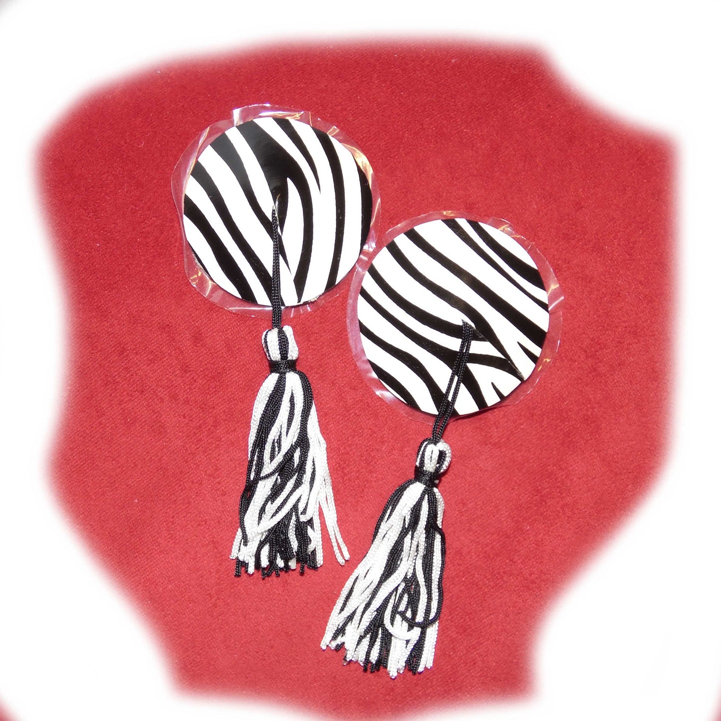 Nippel Cover rund Zebramuster mit Bommel