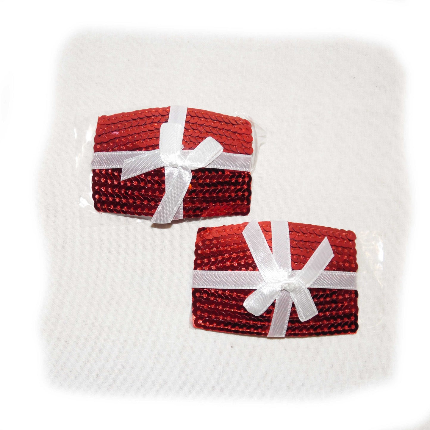 Nippel Cover Geschenk rot Schleife weiß